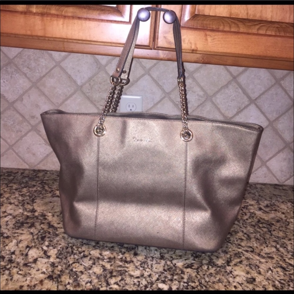 Leather large Calvin Klein purse in gold